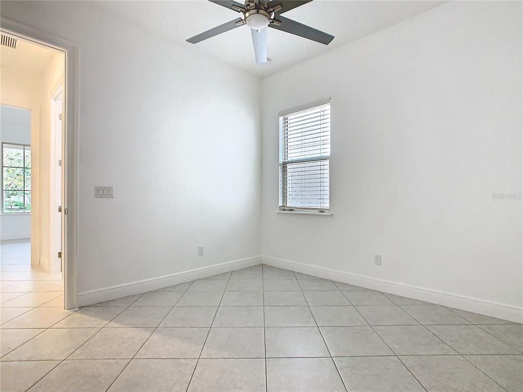 8325 Topsail Place Winter Garden, FL 34787 - Photo 39 of 74 an empty room with windows and fan