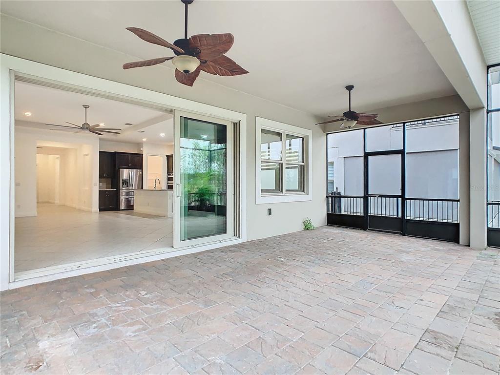 8325 Topsail Place Winter Garden, FL 34787 - Photo 47 of 74 a view of a livingroom with a ceiling fan and window