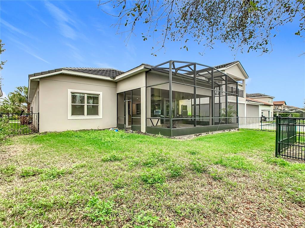 8325 Topsail Place Winter Garden, FL 34787 - Photo 50 of 74 a front view of a house with a yard