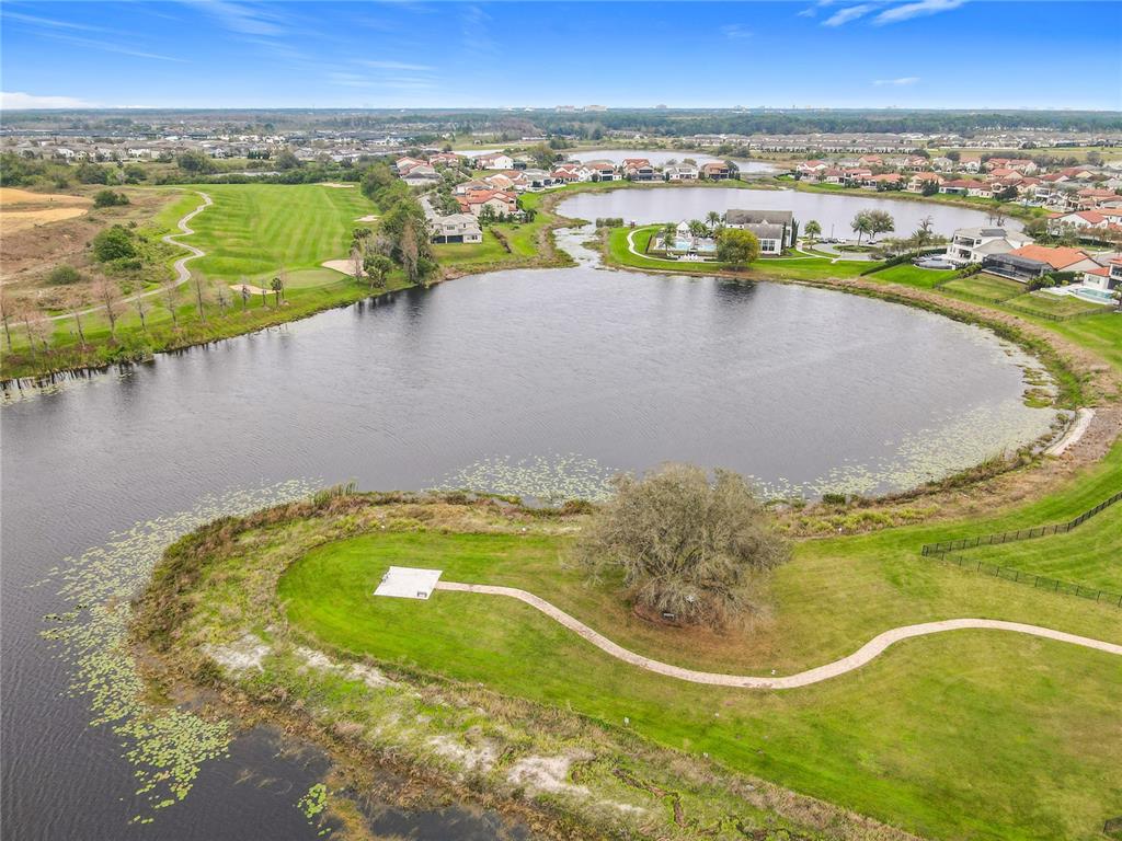 8325 Topsail Place Winter Garden, FL 34787 - Photo 73 of 74 a view of a swimming pool and lake