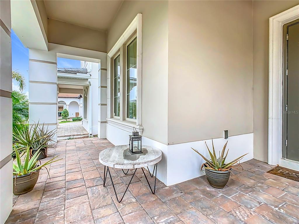 8325 Topsail Place Winter Garden, FL 34787 - Photo 8 of 74 a view of a chairs and table in a patio