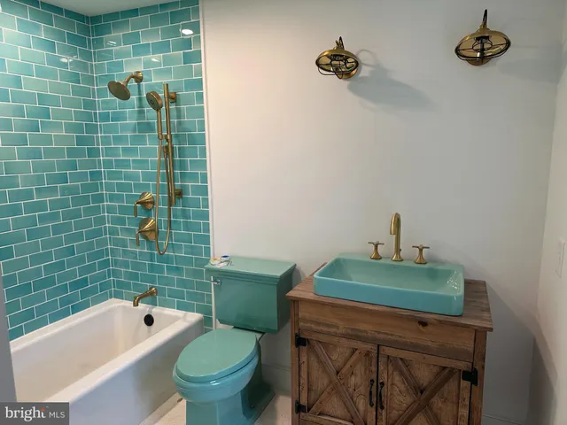 a bathroom with a sink and toilet