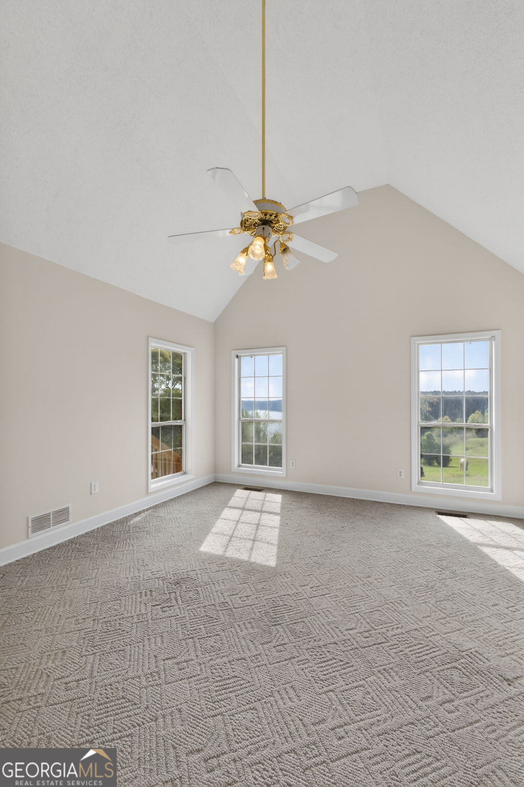 955 Mocassin Gap Road Locust Grove, GA 30248 - Photo 20 of 59 a view of an empty room with a window