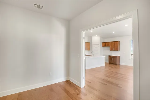 a view of a living room with wooden floor