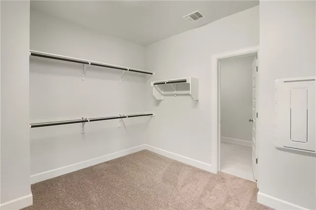 a view of an empty walk in closet