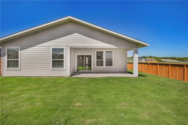 a front view of a house with yard