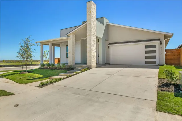 a front view of a house with yard