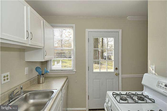 1018 Carson Street Silver Spring, MD 20901 - Photo 8 of 20 a kitchen with sink refrigerator and window