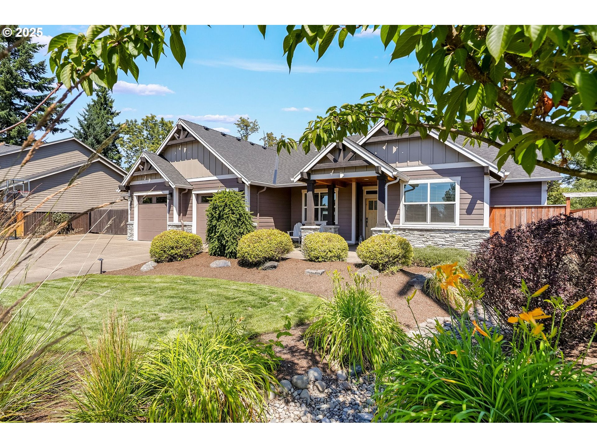 6300 Corvallis Road Independence, OR 97351 - Photo 2 of 48 a front view of a house with a garden