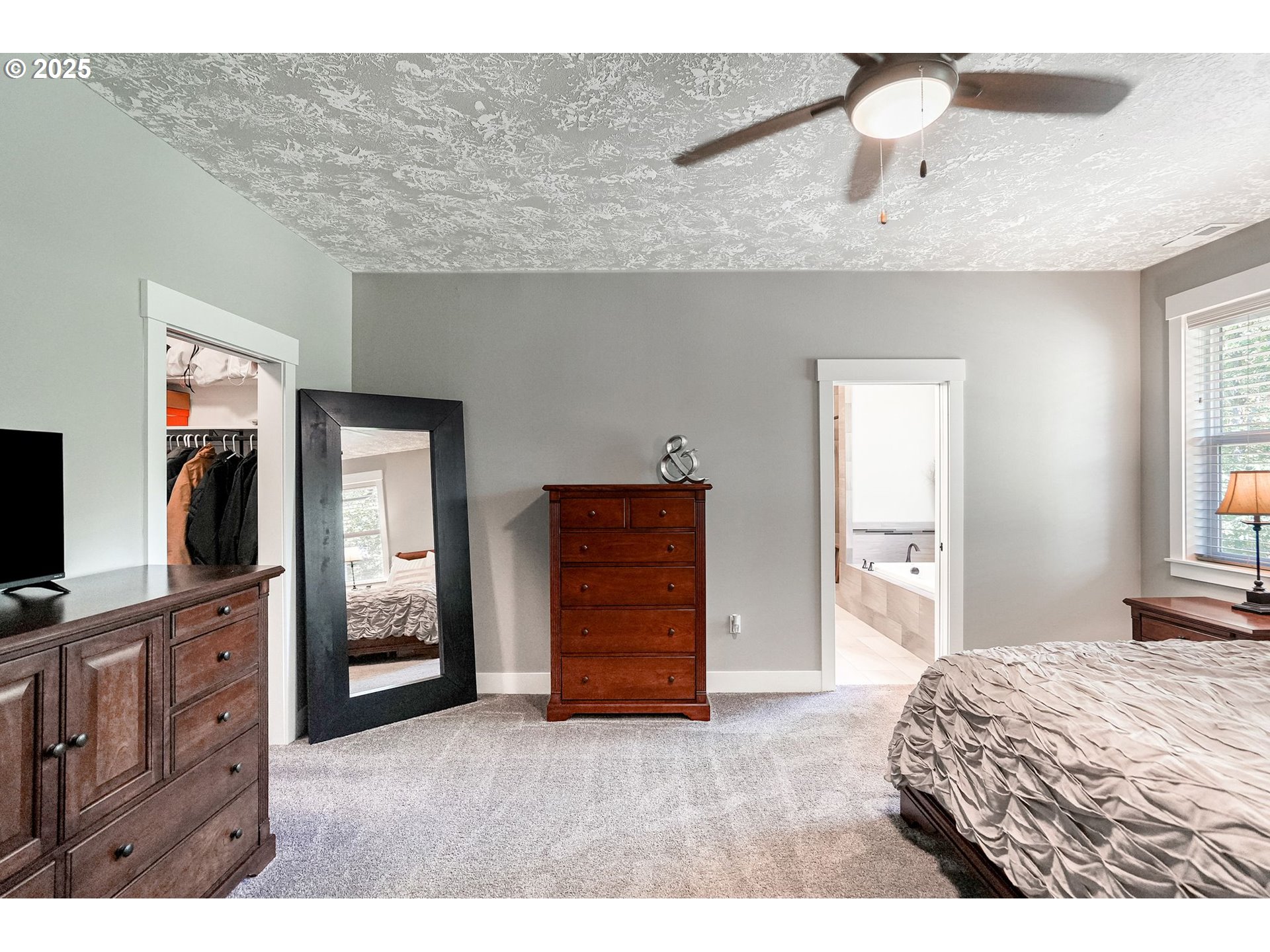 6300 Corvallis Road Independence, OR 97351 - Photo 21 of 48 a bedroom with a bed and a flat tv screen on dresser