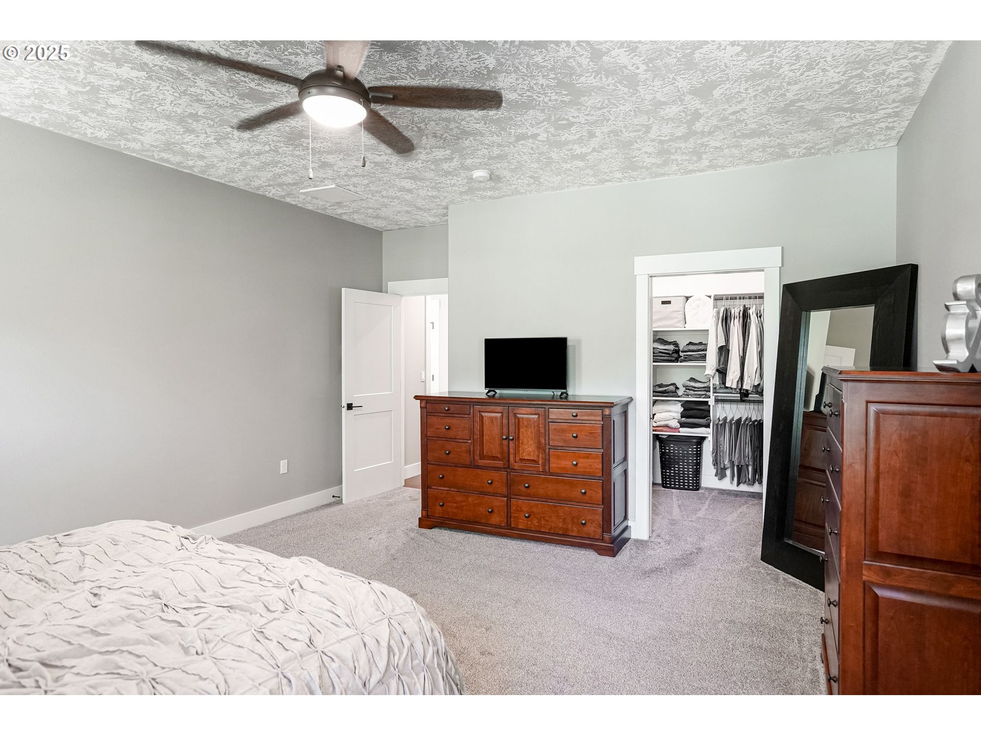 6300 Corvallis Road Independence, OR 97351 - Photo 22 of 48 a bedroom with a bed and a television in it