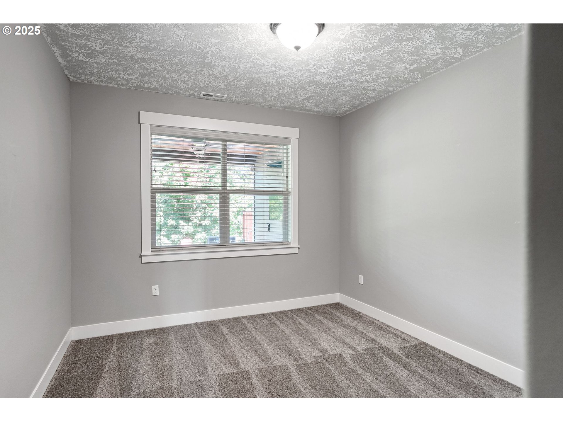 6300 Corvallis Road Independence, OR 97351 - Photo 31 of 48 an empty room with wooden floor and windows