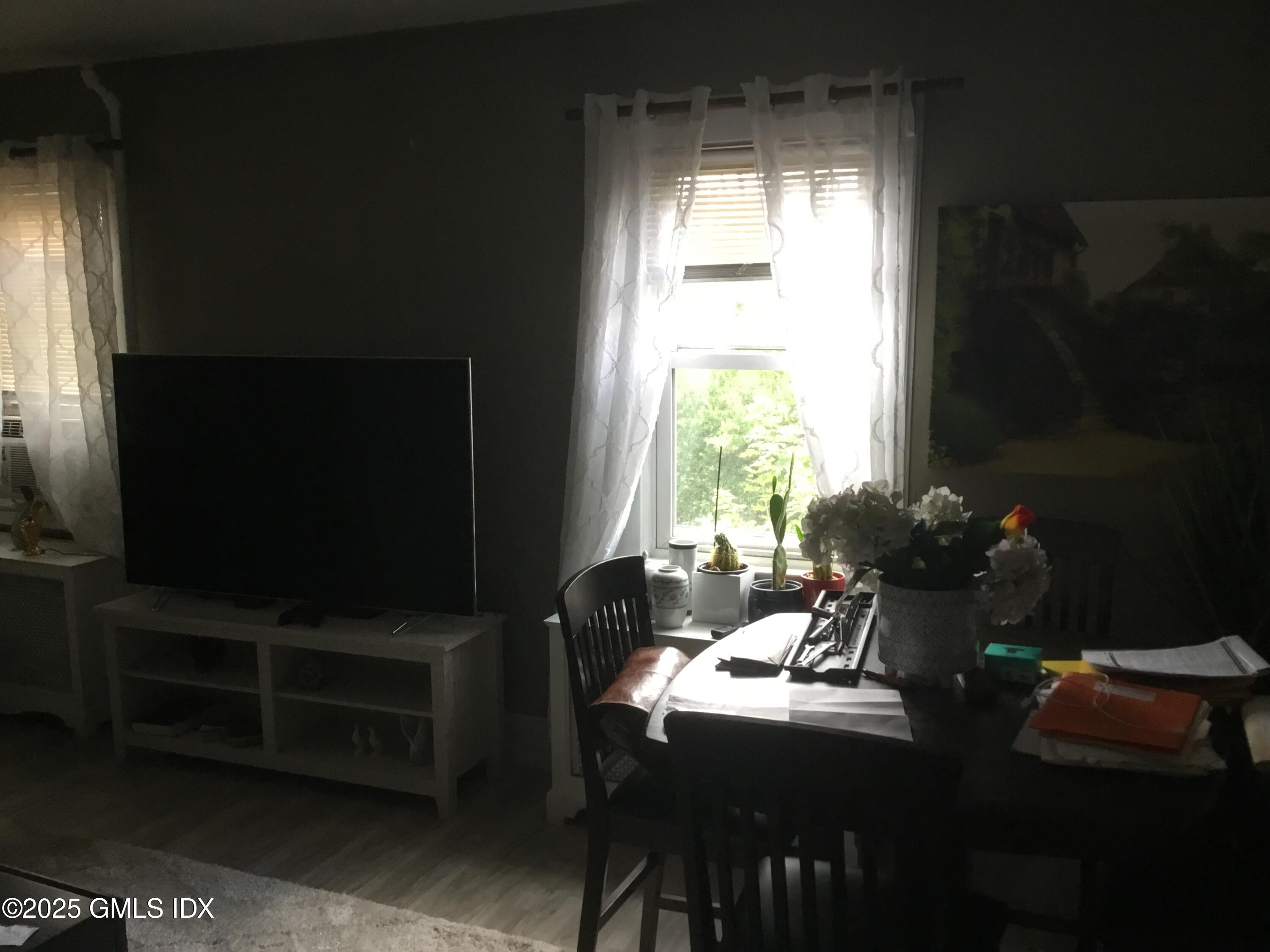 14 Sherman Avenue Greenwich, CT 06830 - Photo 14 of 27 a living room with furniture a flat screen tv and a window