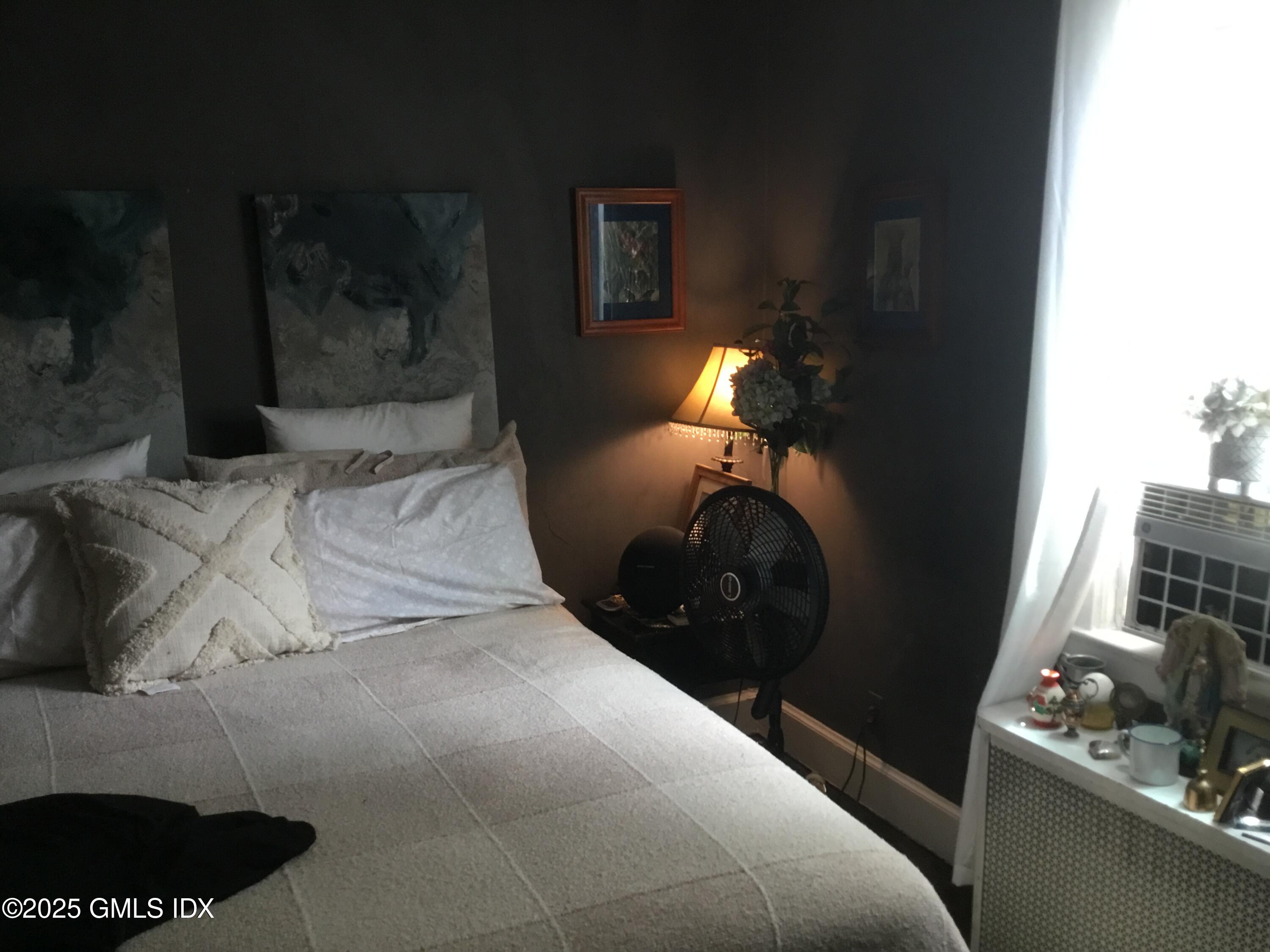 14 Sherman Avenue Greenwich, CT 06830 - Photo 19 of 27 a bed room with a bed