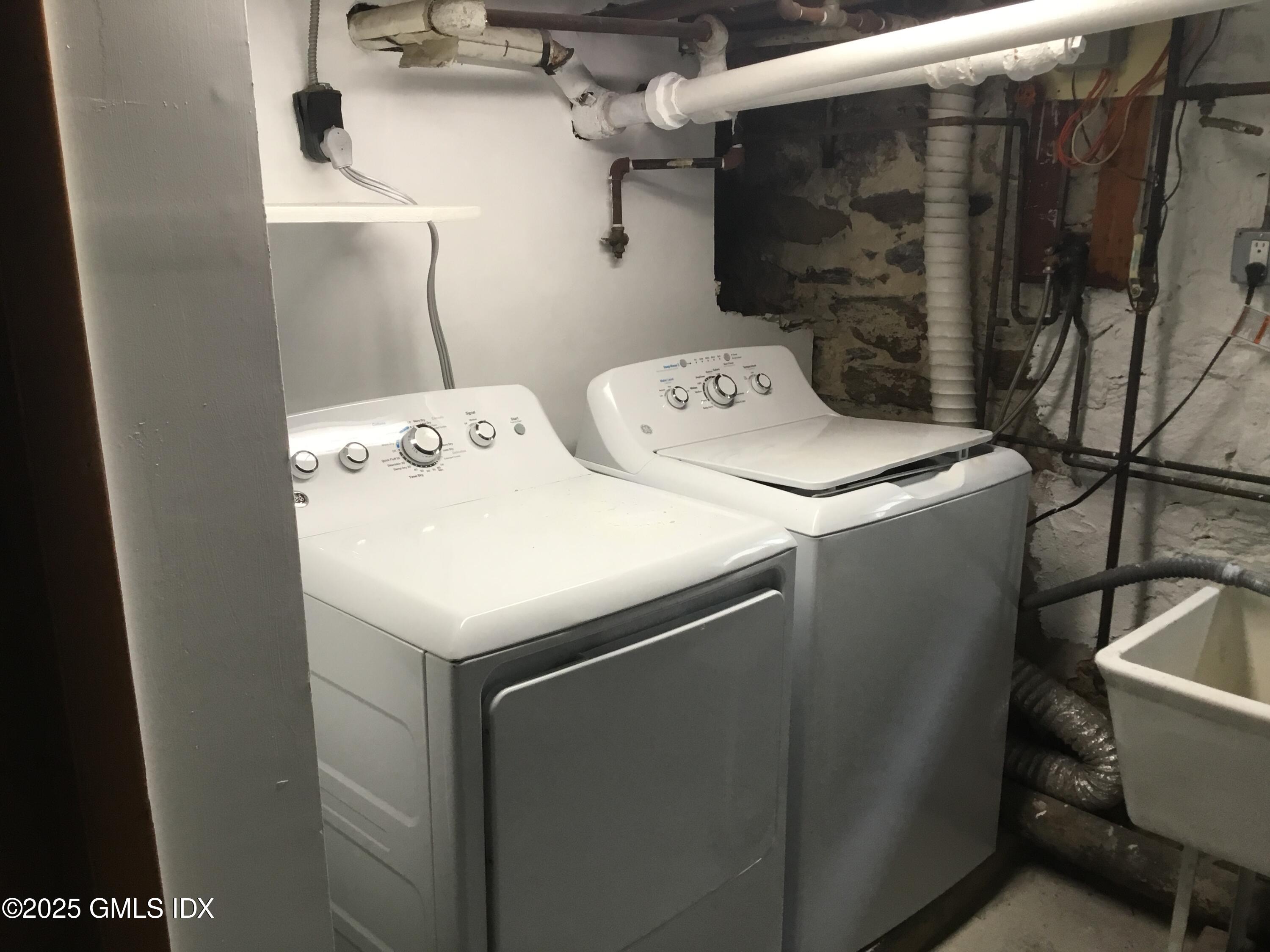 14 Sherman Avenue Greenwich, CT 06830 - Photo 21 of 27 a utility room with dryer and washer