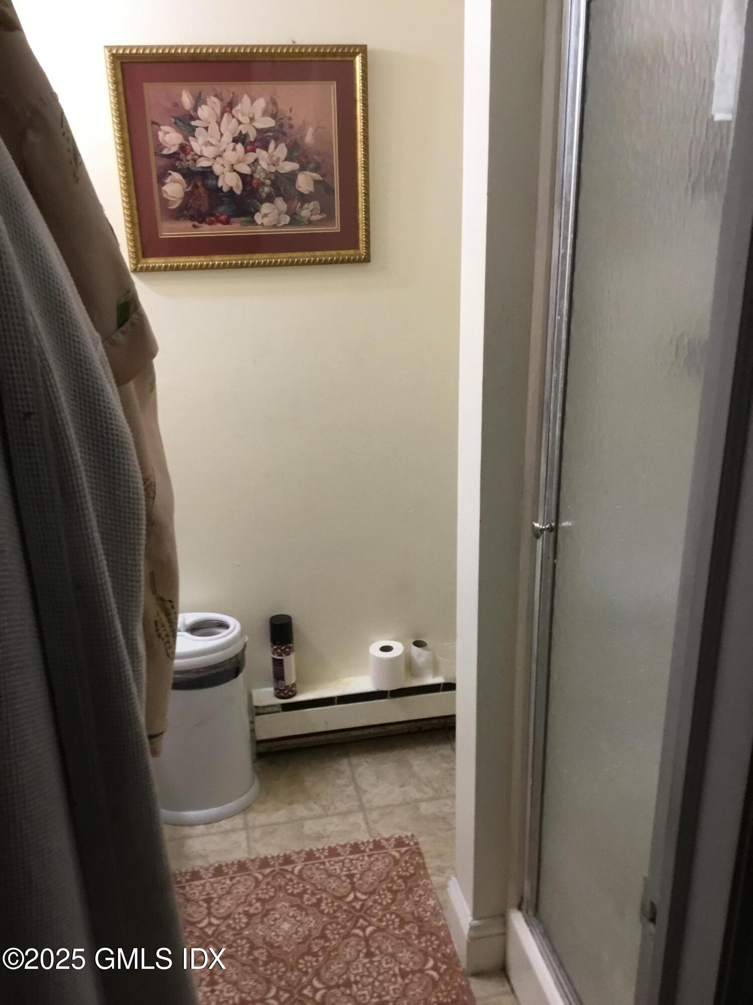 14 Sherman Avenue Greenwich, CT 06830 - Photo 23 of 27 a bathroom with a toilet and a shower