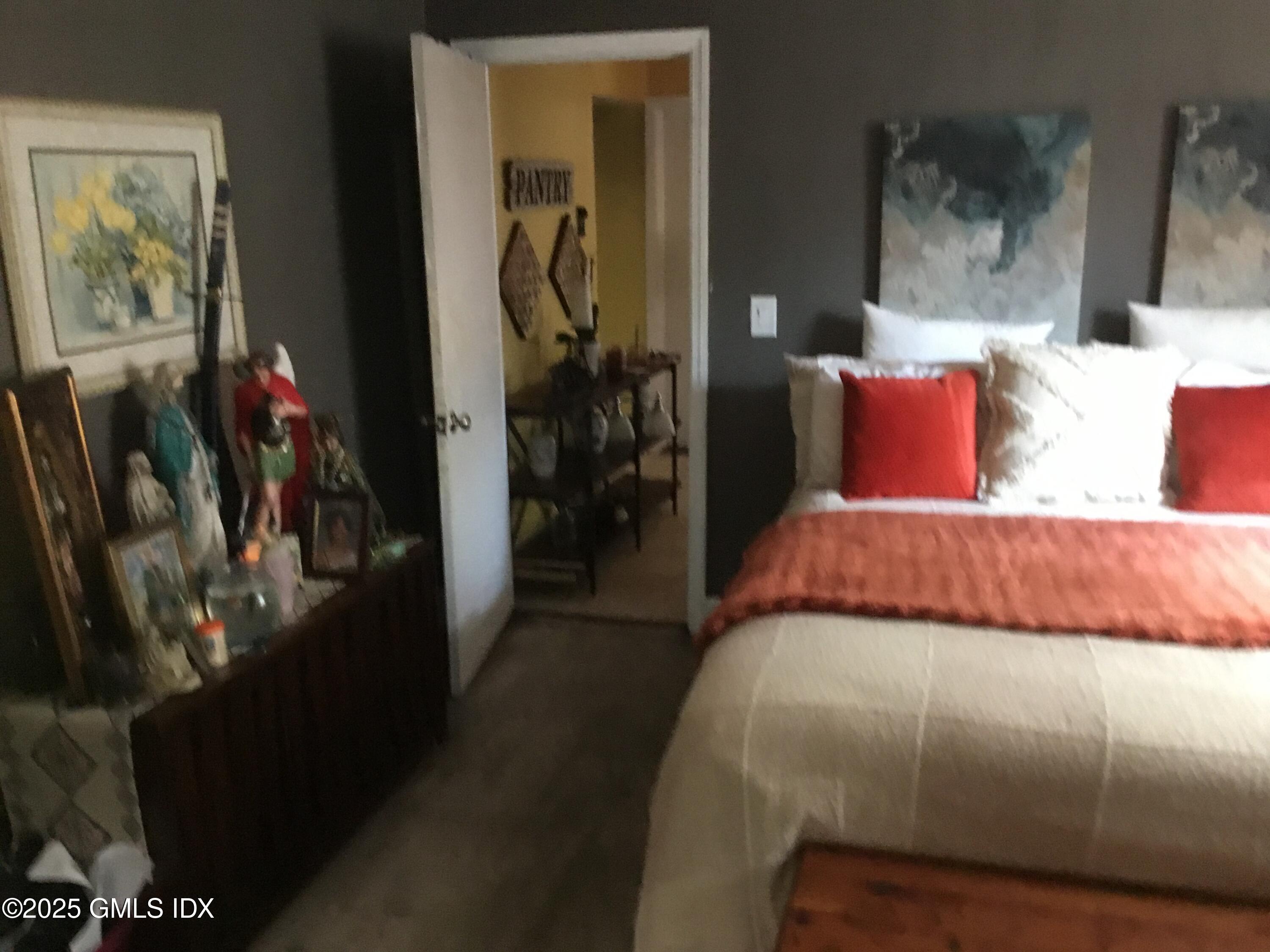 14 Sherman Avenue Greenwich, CT 06830 - Photo 25 of 27 a bed sitting in a bedroom next to a window