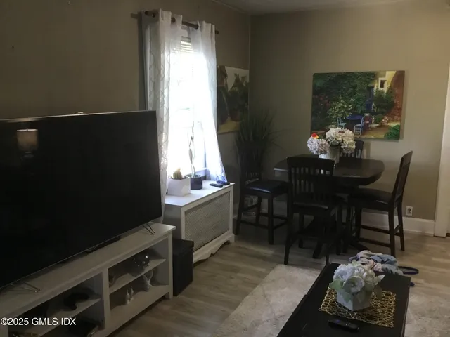 a kitchen with a table chairs and a stove