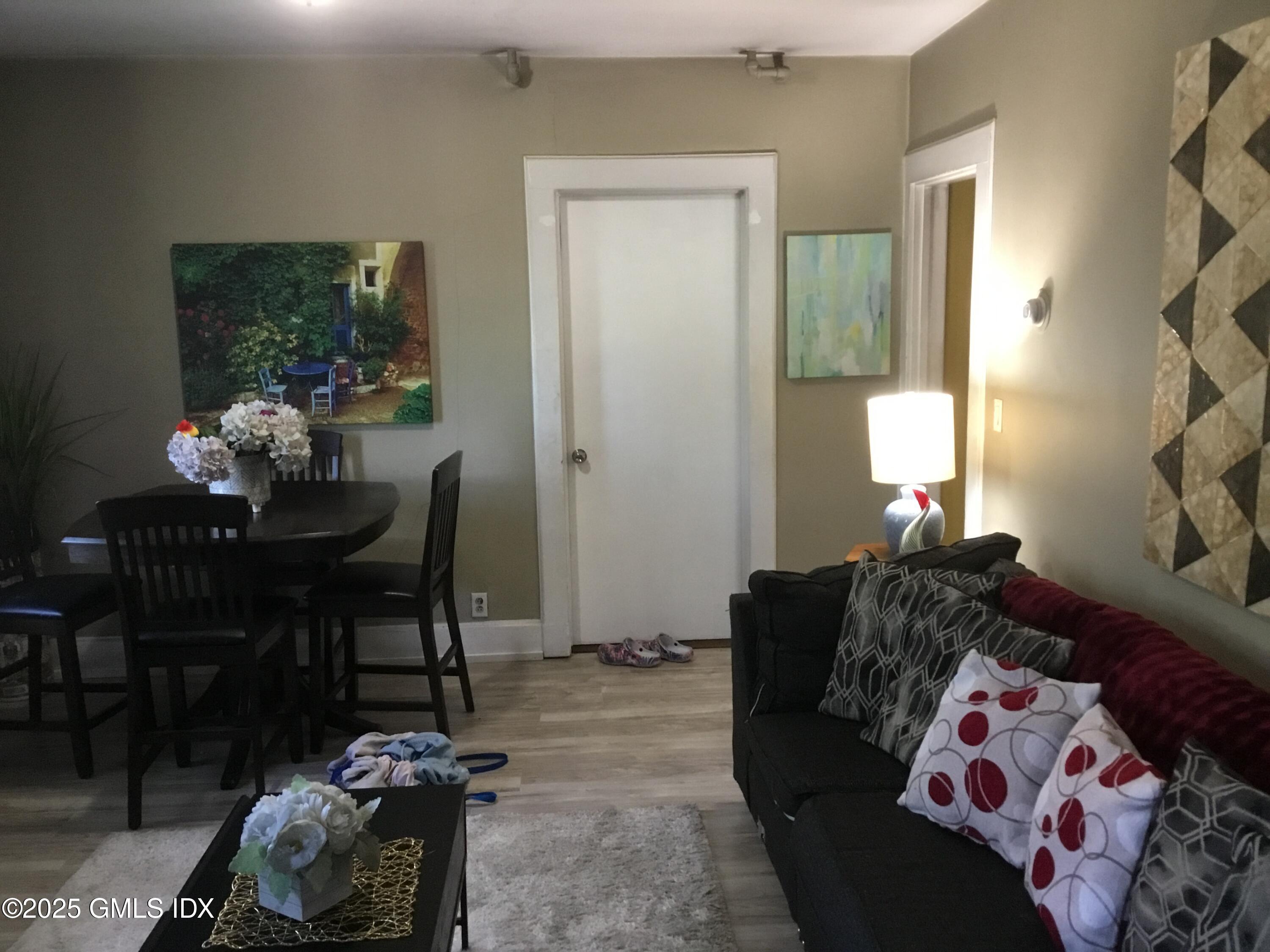 14 Sherman Avenue Greenwich, CT 06830 - Photo 27 of 27 a living room with furniture and a potted plant