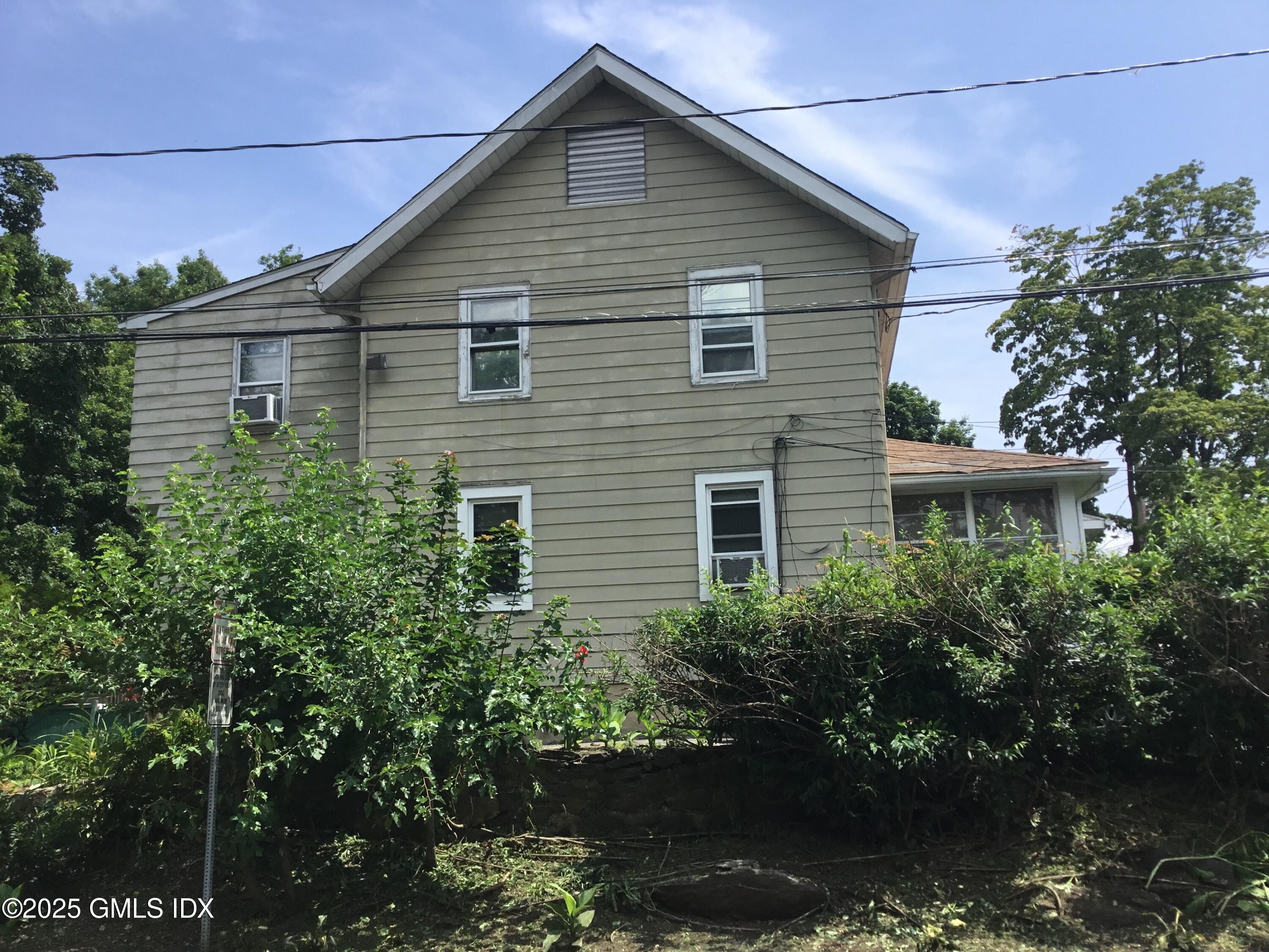 14 Sherman Avenue Greenwich, CT 06830 - Photo 5 of 27 a view of a house with a yard