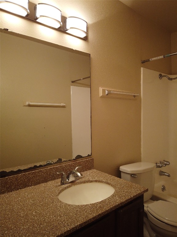 1000 West 26th Street, Unit 209 Austin, TX 78705 - Photo 11 of 20 a bathroom with a granite countertop sink and a mirror