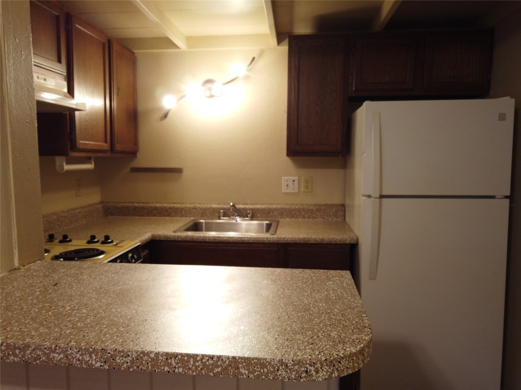 1000 West 26th Street, Unit 209 Austin, TX 78705 - Photo 7 of 20 a bathroom with a sink and a mirror