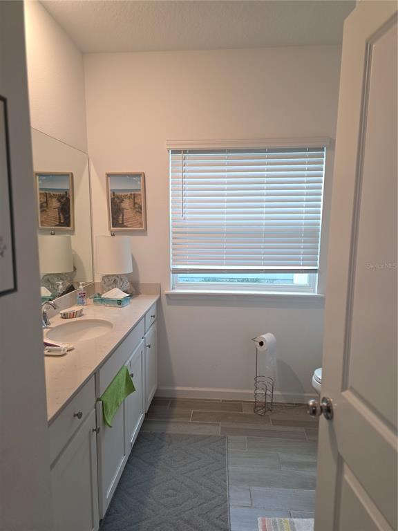 7875 Southwest 74th Street Ocala, FL 34474 - Photo 18 of 28 a bathroom with a sink and a mirror