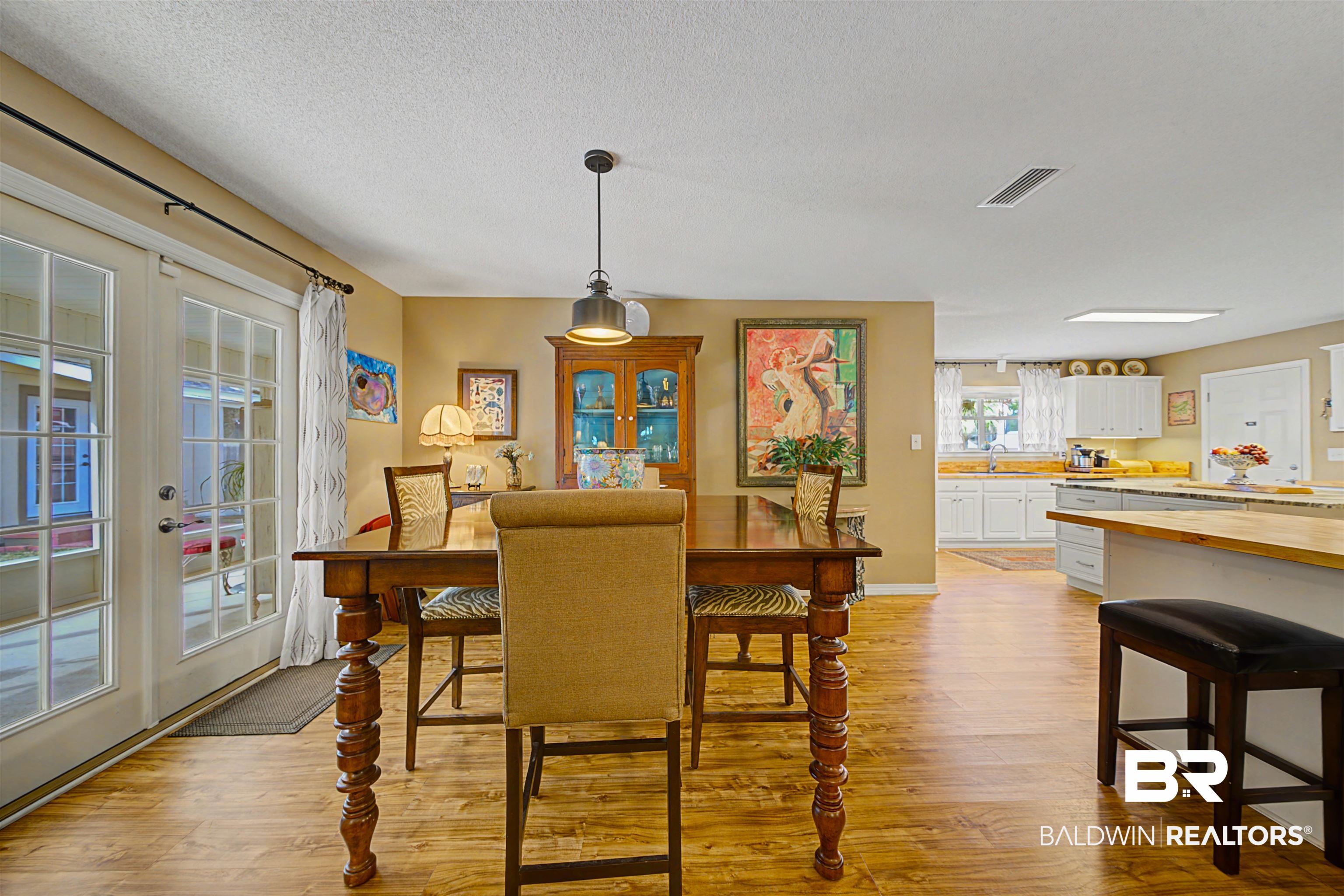 313 Collinwood Loop Foley, AL 36535 - Photo 7 of 36 Dining area featuring light wood finished floors, a textured ceiling, and french doors
