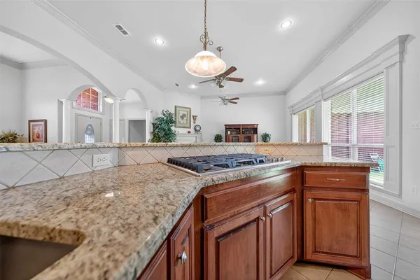 a kitchen with stainless steel appliances granite countertop a stove and a sink