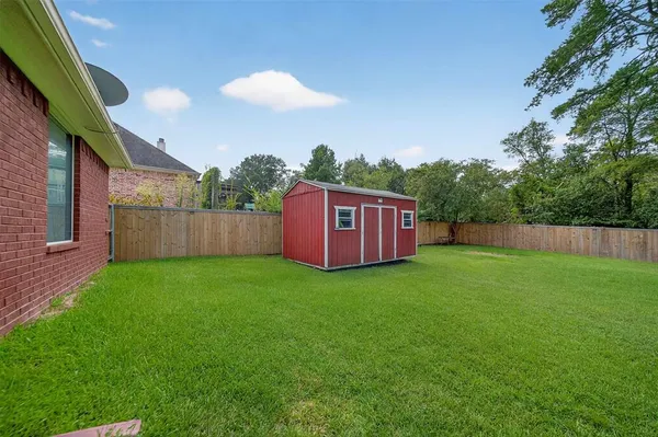 a backyard of a house with lots of green space
