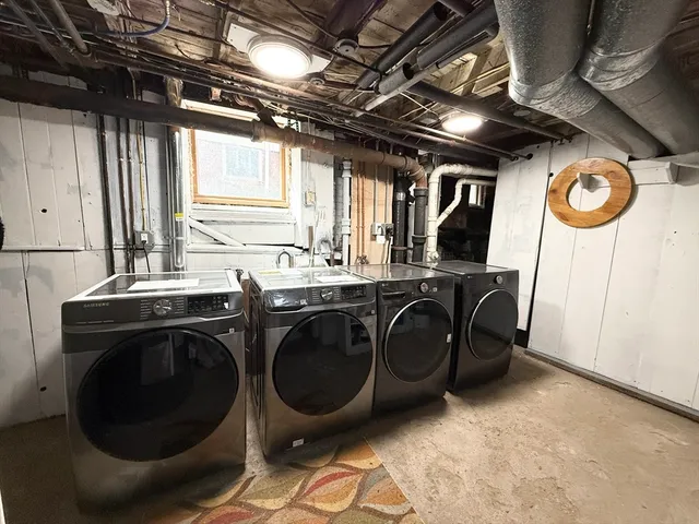 a utility room with sink dryer and washer