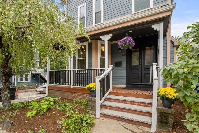 a front view of a house with a porch