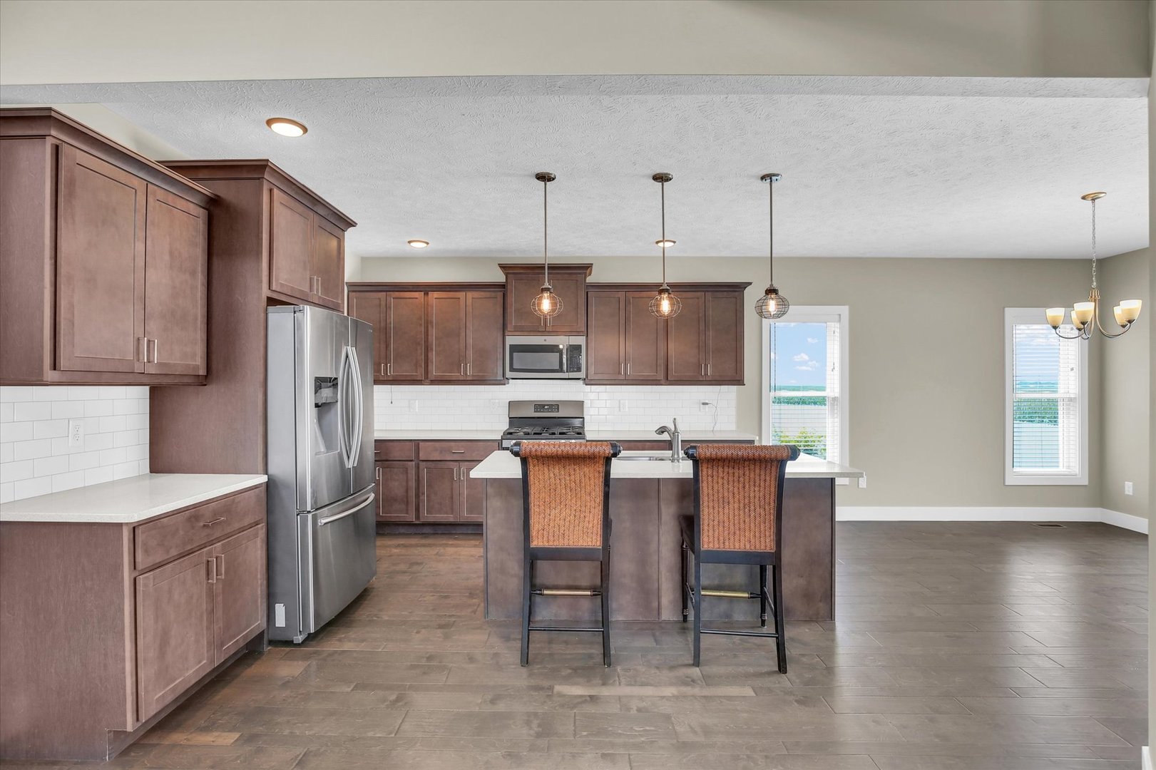 5008 Emmas Way Champaign, IL 61822 - Photo 11 of 53 a large kitchen with a table and chairs
