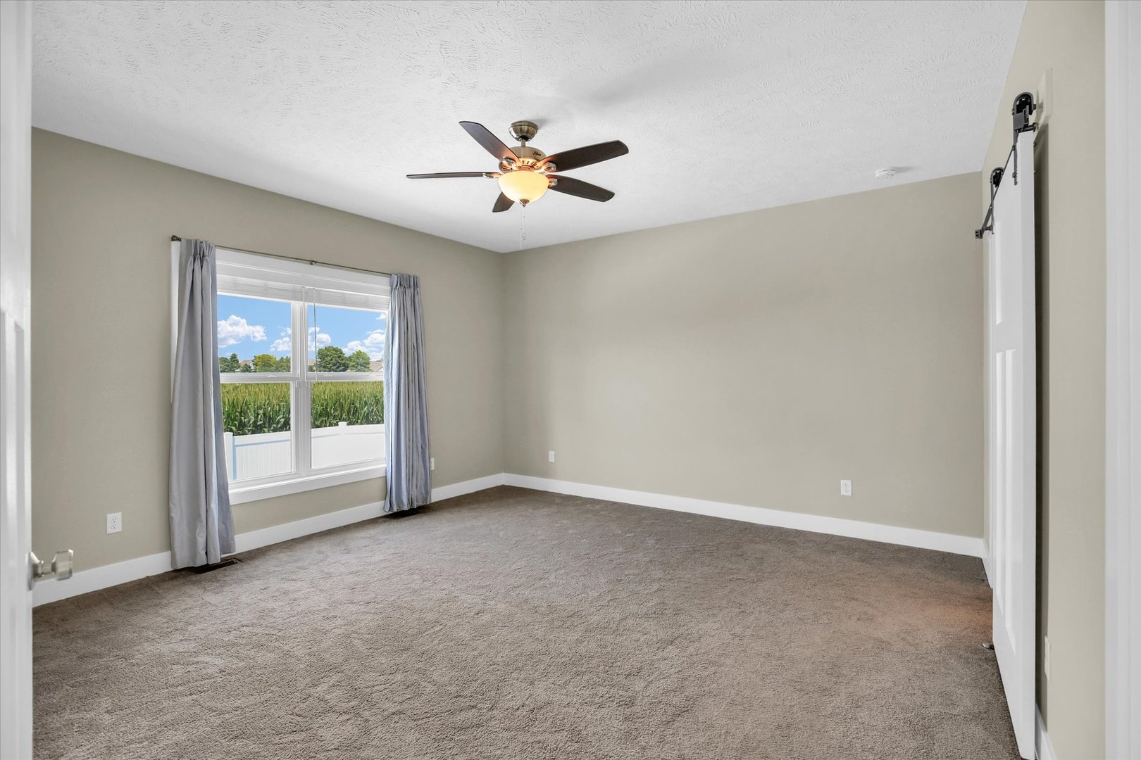 5008 Emmas Way Champaign, IL 61822 - Photo 20 of 53 a view of an empty room with a window