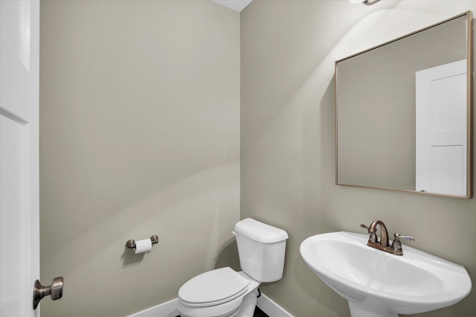 5008 Emmas Way Champaign, IL 61822 - Photo 25 of 53 a white toilet sitting next to a bathroom sink