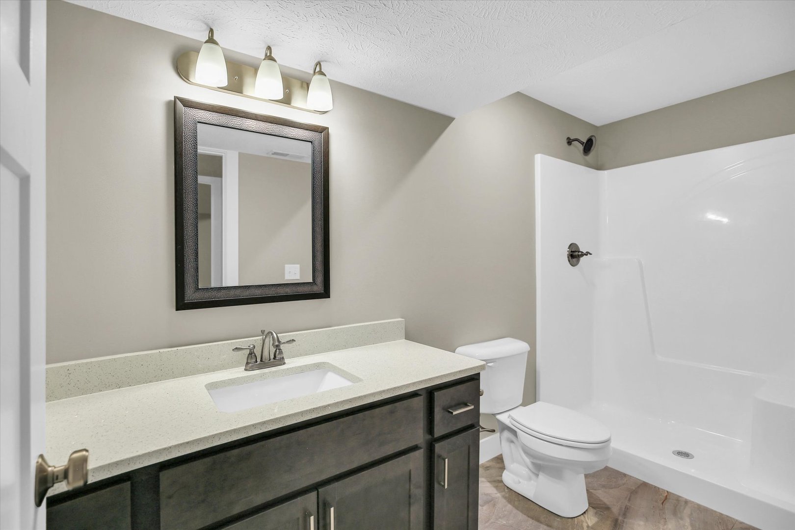 5008 Emmas Way Champaign, IL 61822 - Photo 40 of 53 a bathroom with a granite countertop sink toilet a mirror and shower