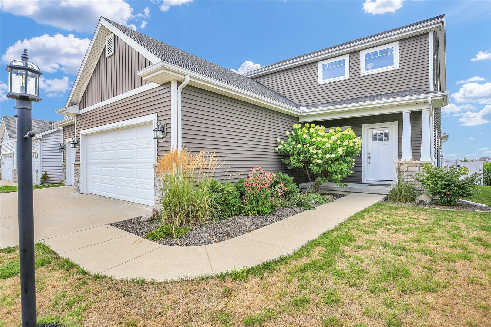 5008 Emmas Way Champaign, IL 61822 - Photo 5 of 53 a view of a house with potted plants