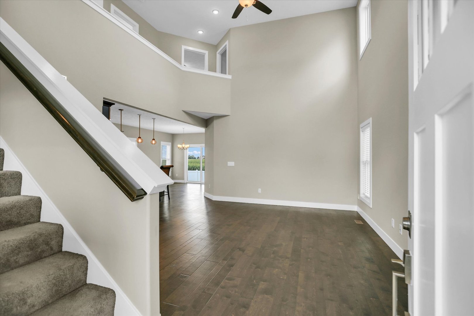 5008 Emmas Way Champaign, IL 61822 - Photo 7 of 53 a view of an entryway with wooden floor