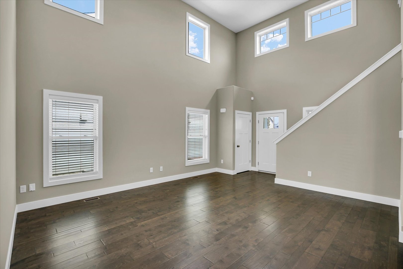 5008 Emmas Way Champaign, IL 61822 - Photo 8 of 53 a view of an empty room with wooden floor and a window