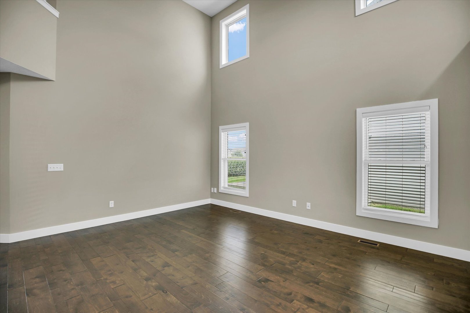 5008 Emmas Way Champaign, IL 61822 - Photo 9 of 53 a view of an empty room with wooden floor and a window