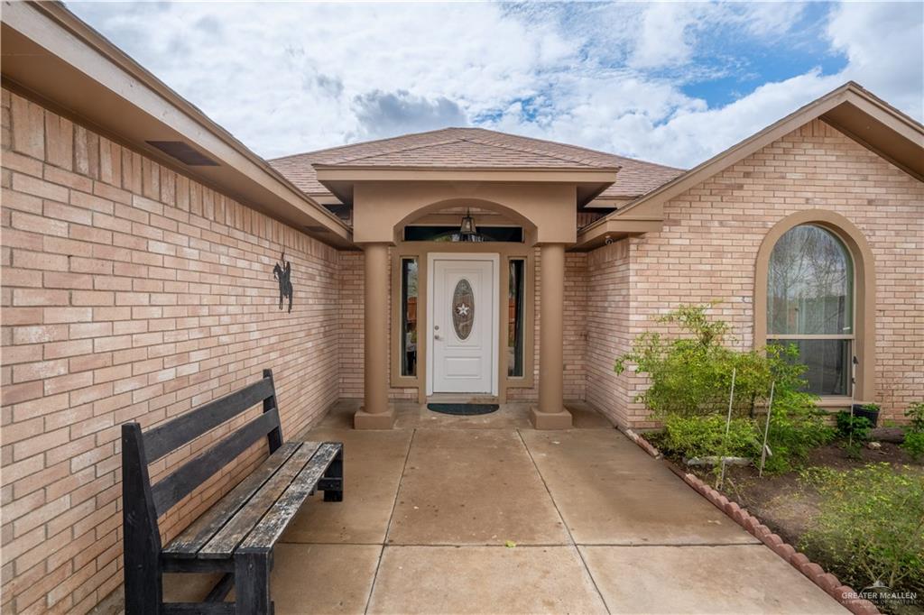 32516 El Preseno Road San Benito, TX 78586 - Photo 12 of 45 a front view of a house with garden