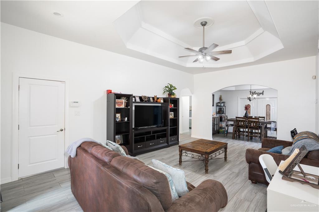 32516 El Preseno Road San Benito, TX 78586 - Photo 17 of 45 a living room with furniture and a flat screen tv