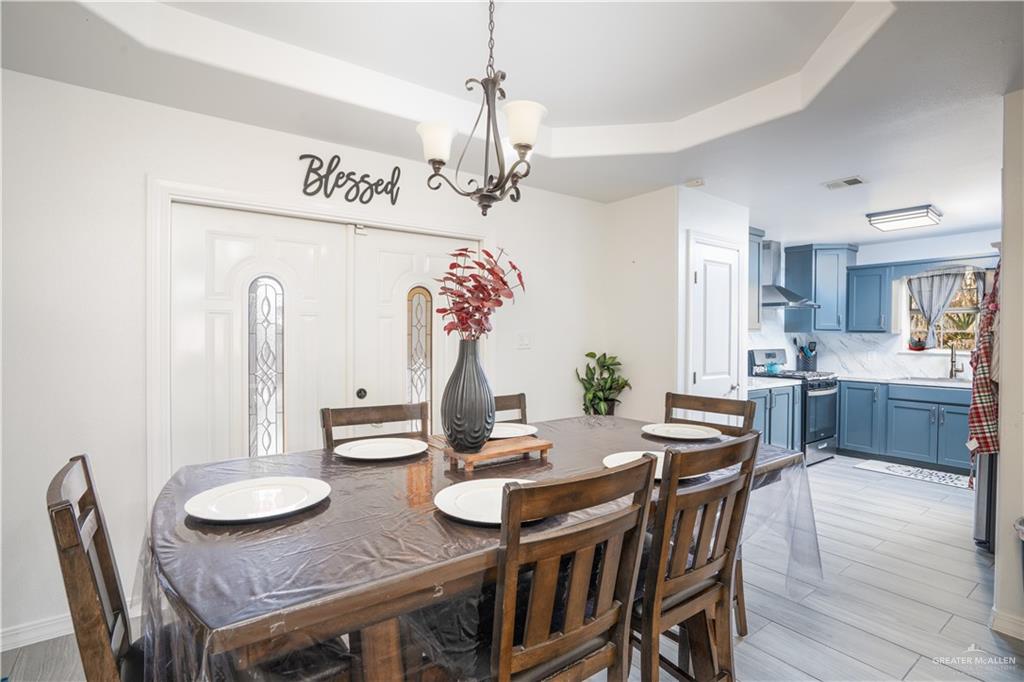 32516 El Preseno Road San Benito, TX 78586 - Photo 25 of 45 a view of a dining room with furniture