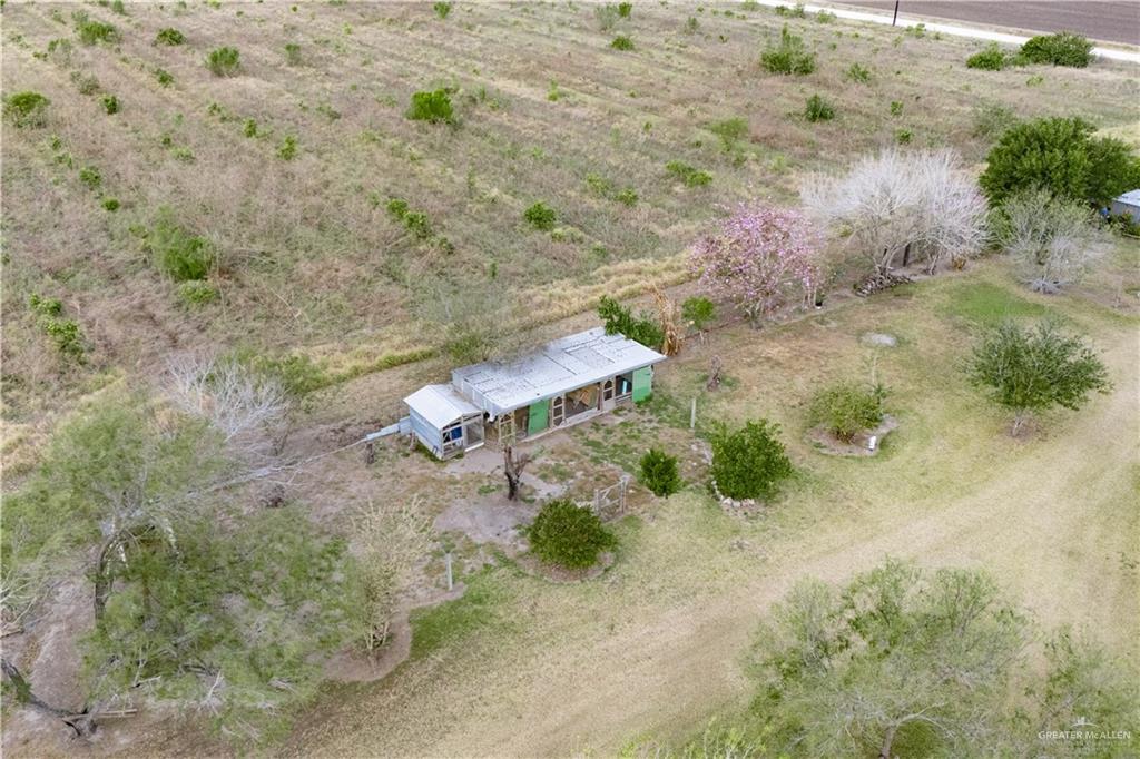 32516 El Preseno Road San Benito, TX 78586 - Photo 36 of 45 a view of a dry yard with wooden floor