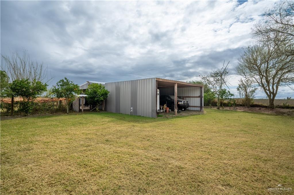 32516 El Preseno Road San Benito, TX 78586 - Photo 5 of 45 a backyard of a house with table and chairs