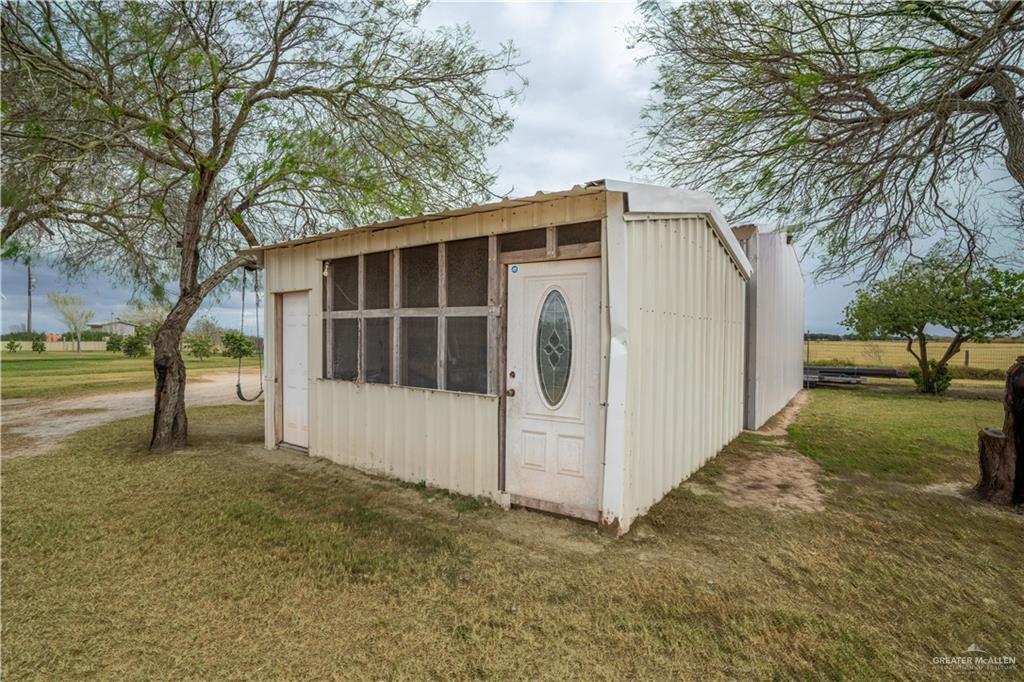 32516 El Preseno Road San Benito, TX 78586 - Photo 7 of 45 a view of a house with a yard