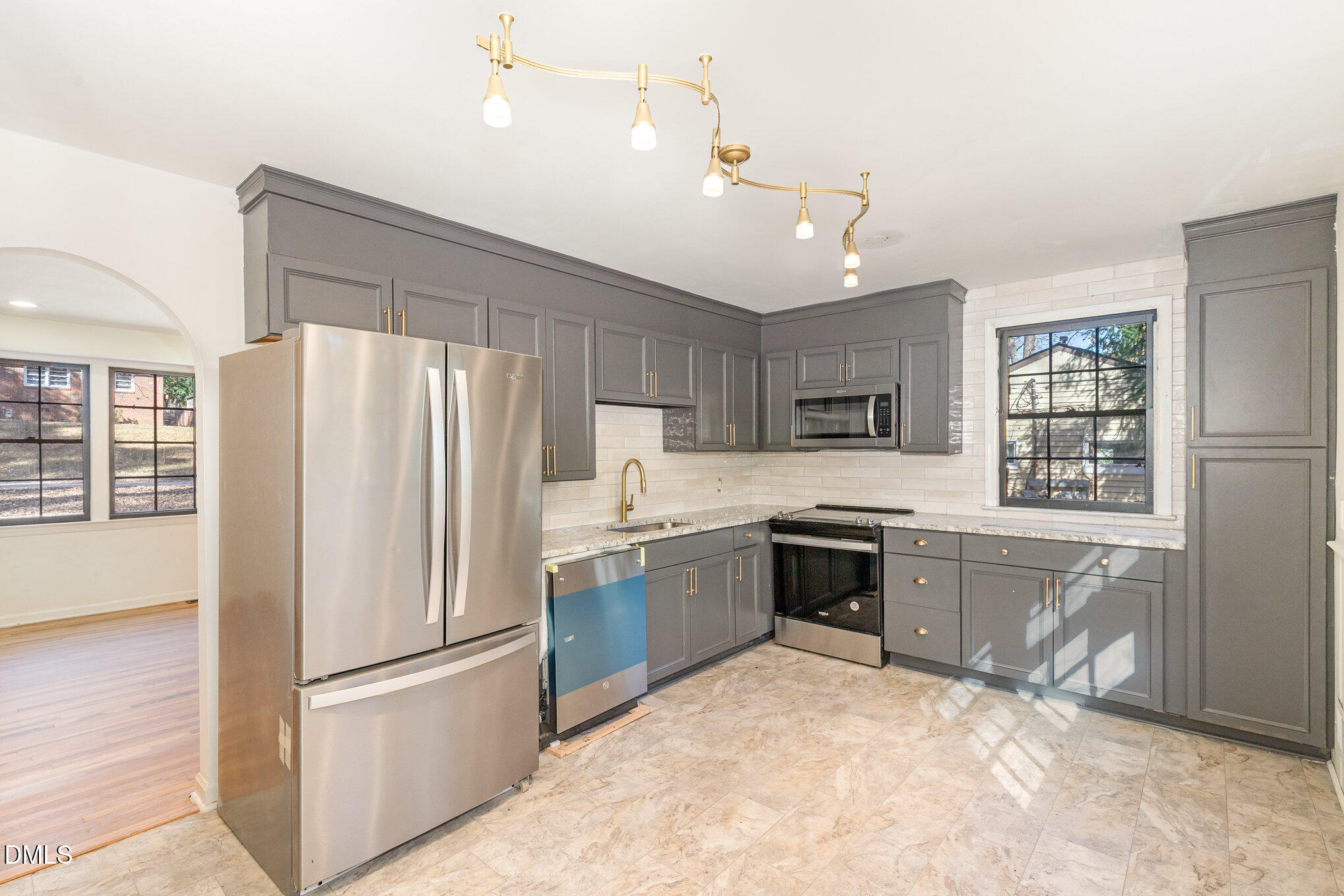 608 Dennis Avenue Raleigh, NC 27604 - Photo 9 of 30 a kitchen with granite countertop stainless steel appliances and refrigerator