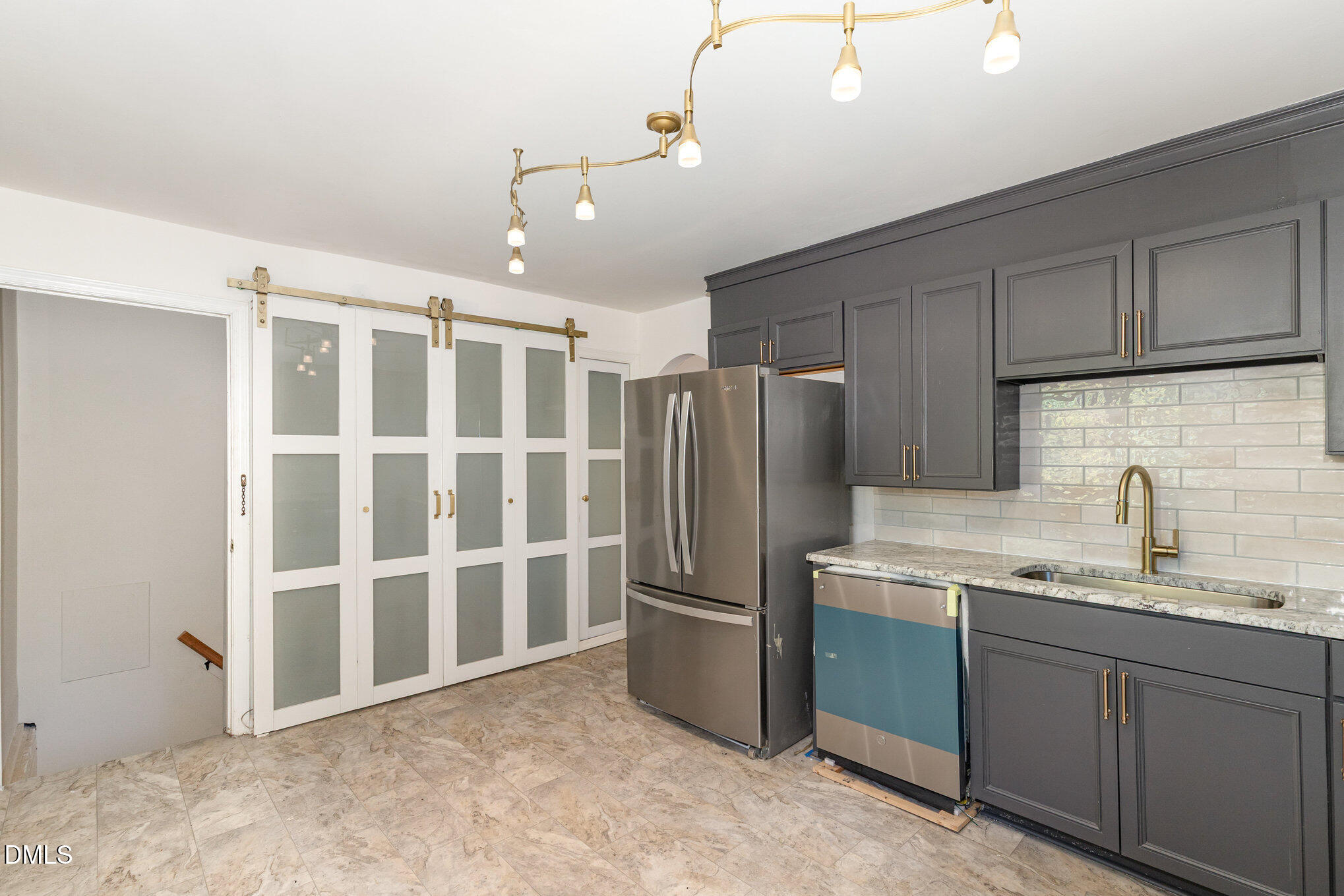 608 Dennis Avenue Raleigh, NC 27604 - Photo 11 of 30 a kitchen with stainless steel appliances granite countertop a refrigerator a sink and dishwasher