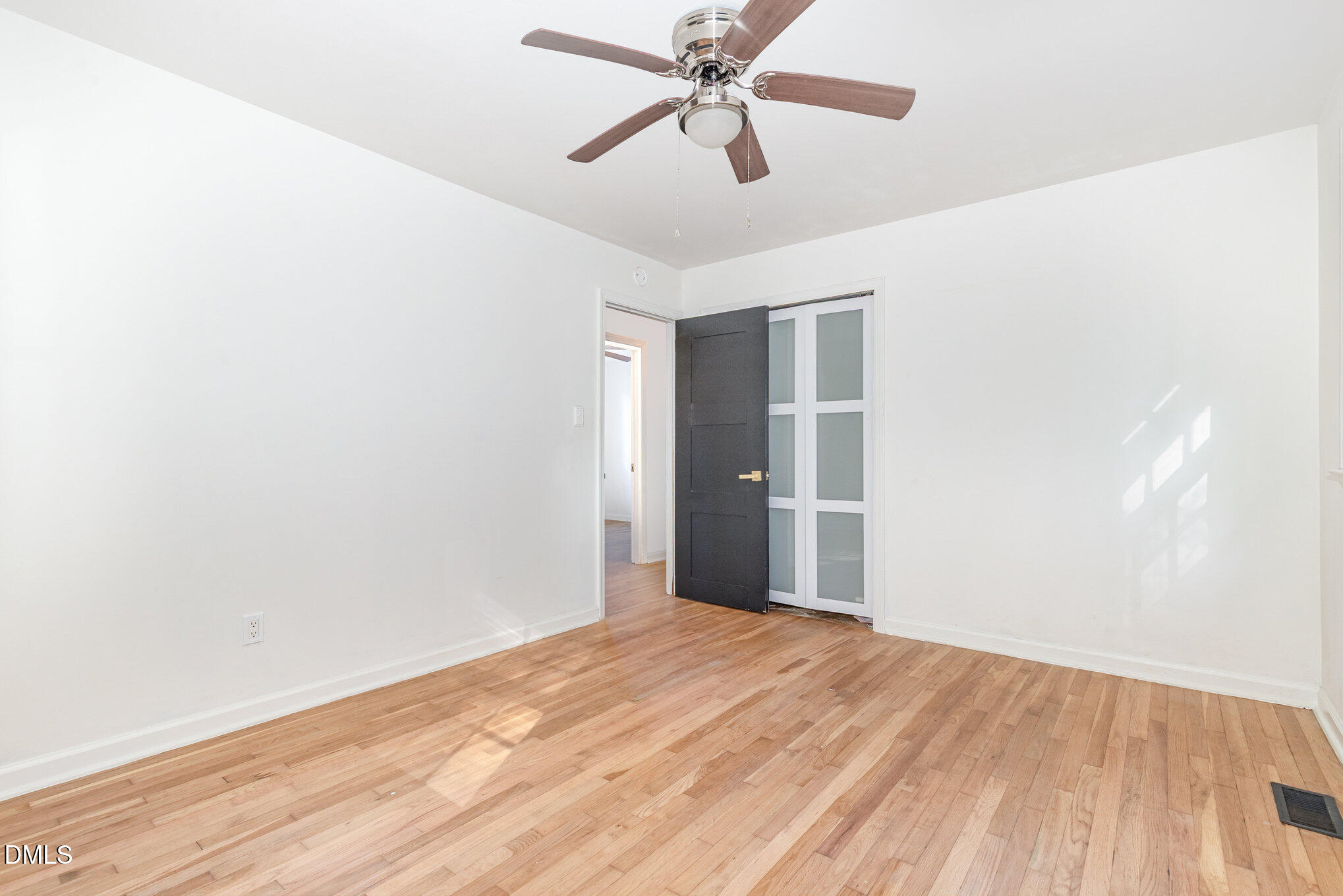 608 Dennis Avenue Raleigh, NC 27604 - Photo 13 of 30 a view of empty room with wooden floor