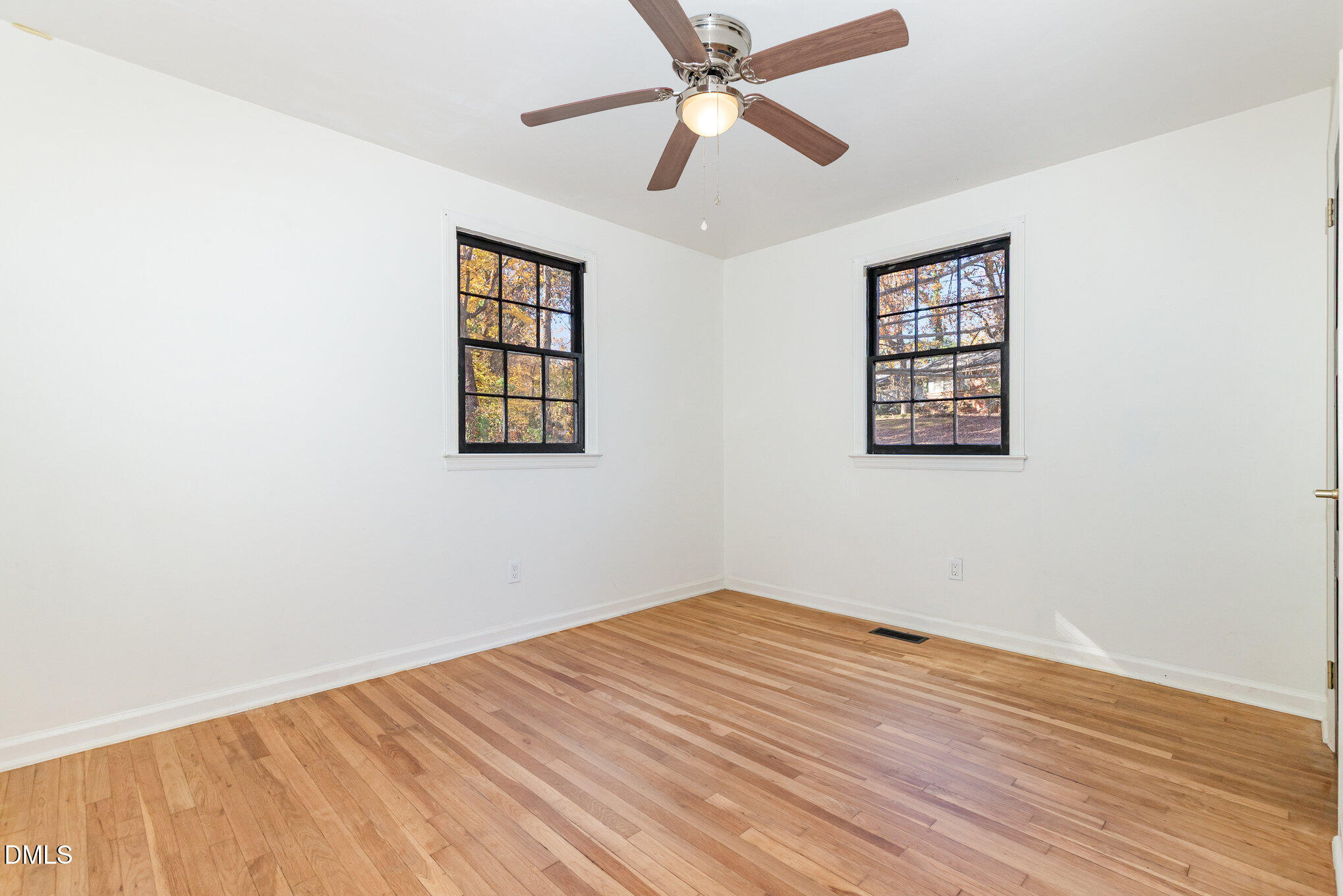 608 Dennis Avenue Raleigh, NC 27604 - Photo 17 of 30 a view of empty room with wooden floor and fan